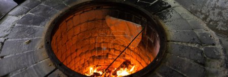Lavash is cooked in the tandoor. bread cookin