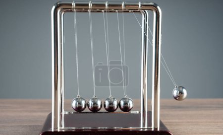 Photo for Harmony in Motion: Newton's Cradle Demonstrates the Beauty of Physics - Royalty Free Image