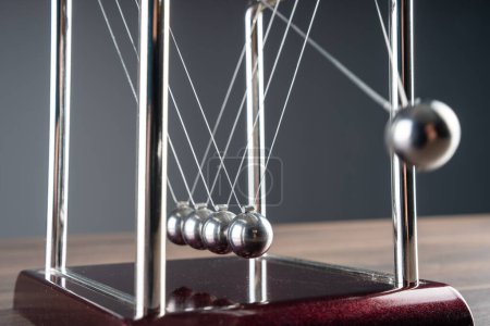 Photo for Harmony in Motion: Newton's Cradle Demonstrates the Beauty of Physics - Royalty Free Image