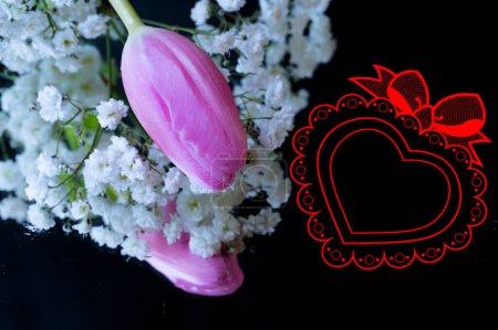 Photo for Beautiful  spring  flowers and heart sign on black background - Royalty Free Image