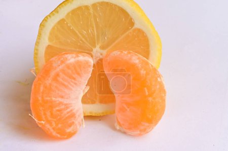 Photo for Ripe tangerine and lemon, close up - Royalty Free Image
