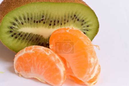 Photo for Close up of kiwi and  ripe tangerine slices - Royalty Free Image
