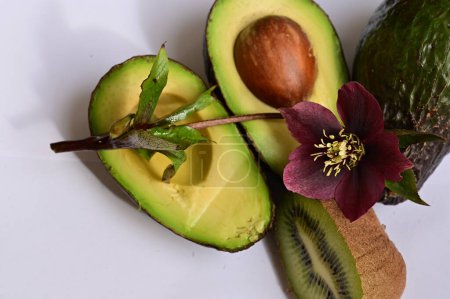 Photo for Flower, kiwi and avocados on a white background - Royalty Free Image