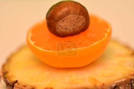 Photo for Pineapple, orange, chestnut, fresh fruits, studio shot - Royalty Free Image