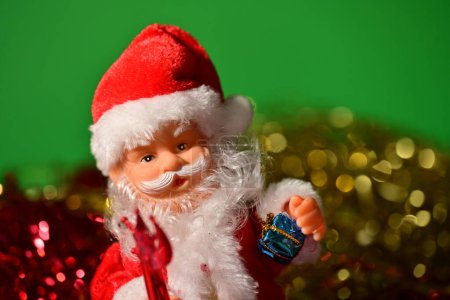 Photo for Santa claus toy on a green  background - Royalty Free Image