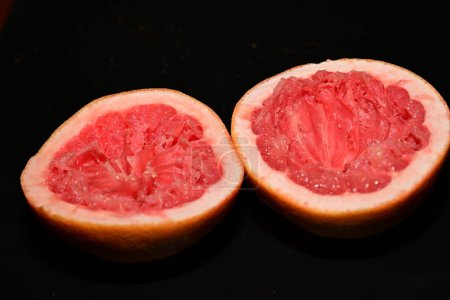 Photo for Fresh halved grapefruit, close up view - Royalty Free Image