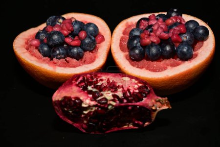 Photo for Pomegranate on a black background - Royalty Free Image