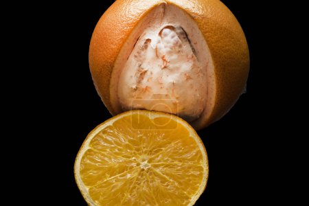Photo for Orange with peeled skin - Royalty Free Image