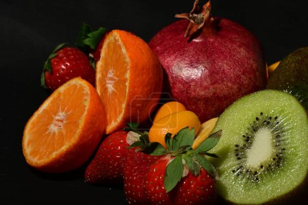 Photo for Assortment of fruits on a black background - Royalty Free Image