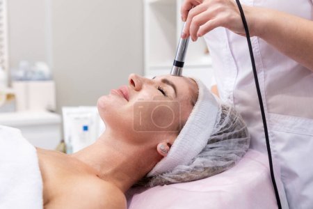 Close-up of woman on professional mesotherapy procedure. Rejuvenation Injections. Cosmetology and skin care.