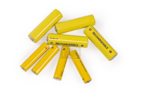 Téléchargez les photos : Yellow rechargeable nickel metal hydride batteries AA size and carbon zinc batteries AAA size on a white background - en image libre de droit