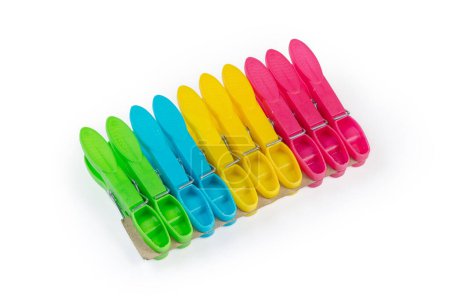Photo for Set of the modern multi-colored spring-type plastic clothespins on a white background - Royalty Free Image