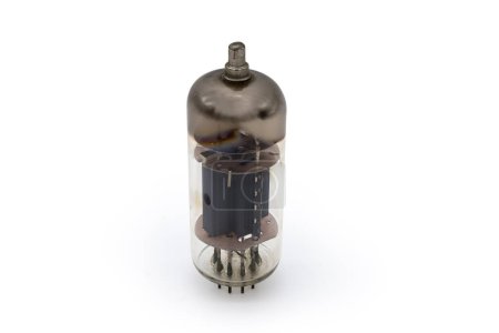 Photo for Old vintage electronic vacuum tube with top cap connections for higher voltages on an anode, stands on a white background - Royalty Free Image