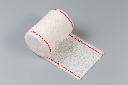 Photo for Modern woven elastic medical bandage rolled into roll on a gray background - Royalty Free Image