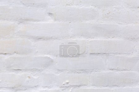 Photo for Fragment of the old many times whitewashed brick outer wall of a building close-up, facade fragment, background - Royalty Free Image