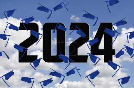 Airborne blue graduation caps for 2024 in sky with white clouds-stock-photo