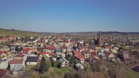 Panorama from a bird's eye view. Central Europe: The Polish town of Kolaczyce is located among the green hills. Temperate climate. Flight drones or quadrocopter. aerial view of a tourist city.