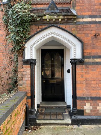 Foto de Black front door of a beautiful brick house in England - Imagen libre de derechos