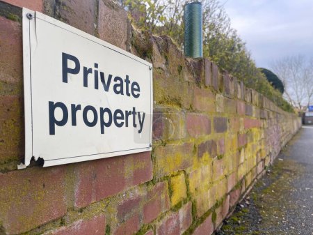 Photo for Close up of a private property sign on a brick wall - Royalty Free Image