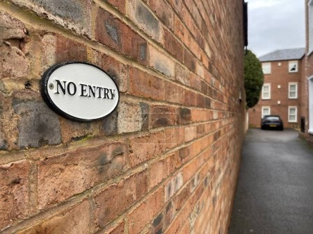 Photo for Selective focus on no entry sign on brisk wall, residential building on background - Royalty Free Image