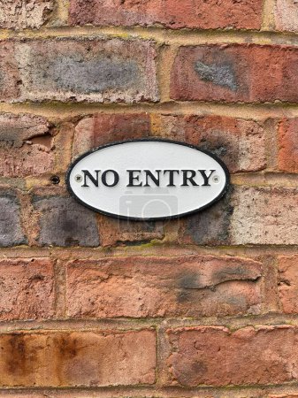 Photo for Close up of old fashioned metal no entry sign on brick wall - Royalty Free Image