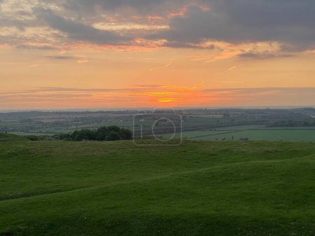 Photo for Landscape shot of green hills on sunset - Royalty Free Image