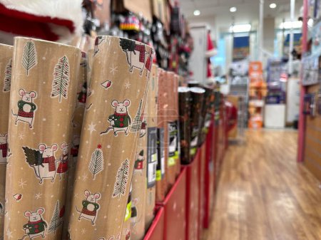 Photo for Selective focus on christmas wrapping paper, crafts shop interior on background - Royalty Free Image