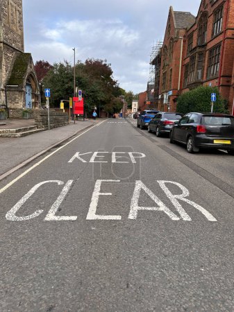 Photo for Keep clear sign painted on car road - Royalty Free Image