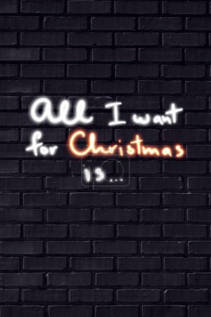 Photo for All I want for Christmass neon sign on black brick wall - Royalty Free Image