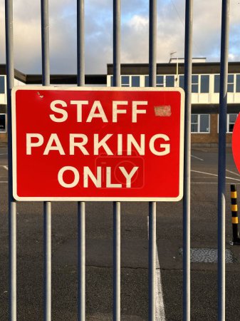 Photo for Staff parking only red road sign on metal fence - Royalty Free Image