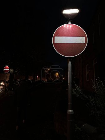 Photo for No entry red road sign illuminated at night - Royalty Free Image