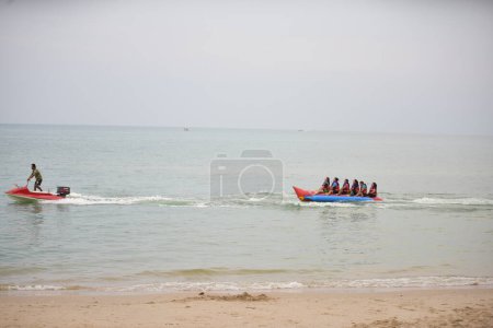 Photo for Happy people having fun riding Banana Boat - Royalty Free Image