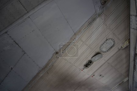 Photo for Airplane metallic fuselage detail with rivets - Royalty Free Image