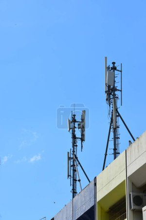 Photo for Closeup of cellular antenna against a clear blue sky. - Royalty Free Image