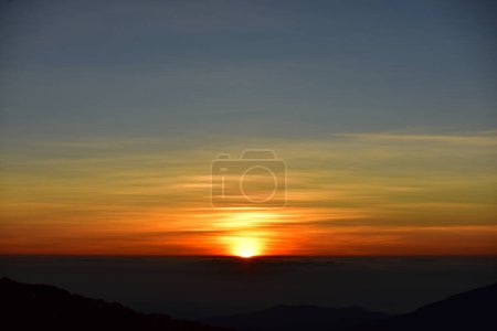 Photo for Scenic sunrise in mountains covered with fog - Royalty Free Image