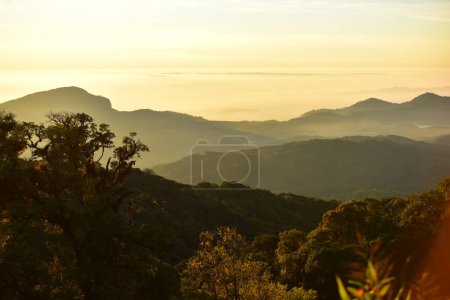 Photo for Beautiful sky and golden clouds, mountains before sunrise. Look from the top of the hill. - Royalty Free Image