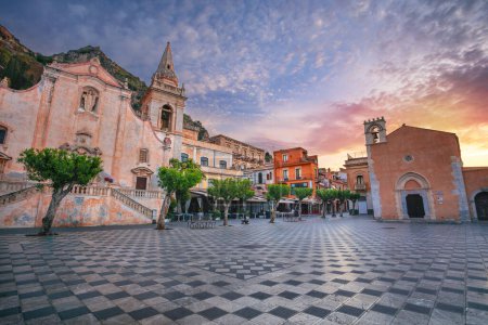 Photo for Taormina, Sicily, Italy. Cityscape image of picturesque town of Taormina, Sicily with main square Piazza IX Aprile and San Giuseppe church at sunrise. - Royalty Free Image