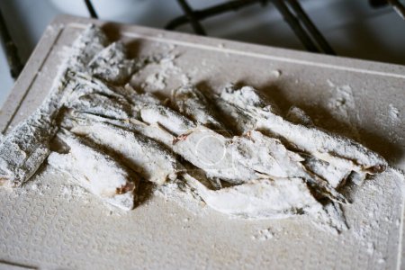 small river fish in flour before frying