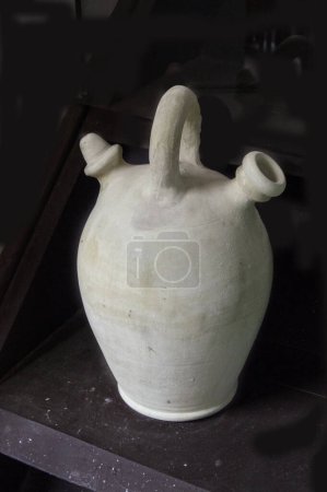 Photo for Spanish clay jug isolated on black background in the museum - Royalty Free Image