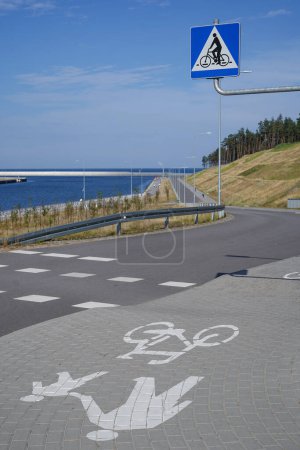 bike path along canal to the Baltic Sea on the Vistula Spit, Pomeranian Voivodship, Poland                      