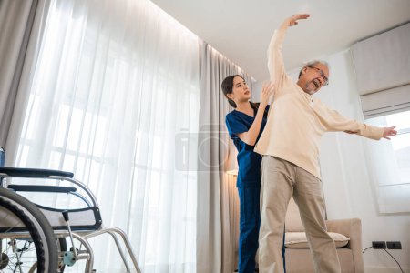 Photo for Old senior man enjoys training with physiotherapist for outstretched arms at home, Asian physical therapist patient nursing helping elderly exercising arm stretch, Rehabilitation of disabled concept - Royalty Free Image