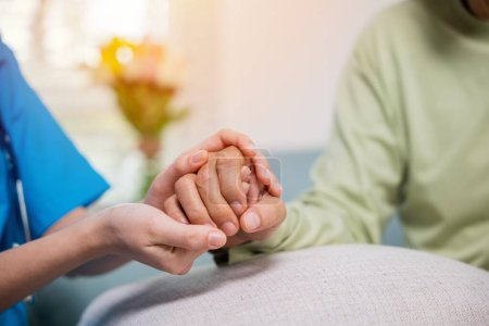 Photo for Closeup hand. Young woman helping hold hands offering her senior man, Caring nurse helping elderly old man care gets help from hospital, medical health care, International Day for the Elderly concept - Royalty Free Image