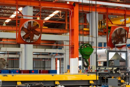 Photo for Big industrial cooler red fans in factory for reduced heat in operation ventilation of plant, industry cooling mechanical fan - Royalty Free Image
