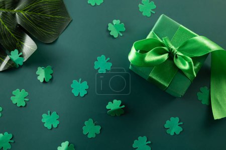 Photo for Happy St Patricks Day decoration background concept. shamrocks leaves holiday symbol with copy space on pastel background, above view gift box green clover leaves - Royalty Free Image