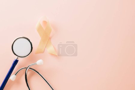 Téléchargez les photos : Pink awareness ribbon sign and stethoscope of International World Cancer Day campaign month on pastel pink background with copy space, concept of medical and health care support, 4 February - en image libre de droit