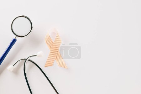 Photo for Pink awareness ribbon sign and stethoscope of International World Cancer Day campaign month isolated on white background with copy space, concept of medical and health care support, 4 February - Royalty Free Image