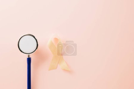 Photo for Pink awareness ribbon sign and stethoscope of International World Cancer Day campaign month on pastel pink background with copy space, concept of medical and health care support, 4 February - Royalty Free Image