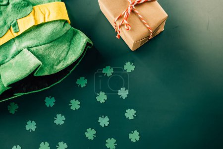 Photo for Happy St Patricks Day decoration background concept. Top view gift box green clover leaves, shamrocks leaves holiday symbol with copy space on green background - Royalty Free Image