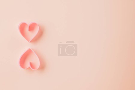 Téléchargez les photos : Happy Valentines Day. Flat lay pink ribbon heart shaped on pastel pink background, Festive background with copy space, Valentines day concept - en image libre de droit