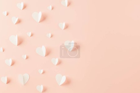 Foto de Top view flat lay of paper elements cutting white hearts shape flying on pink background, Banner template greeting card design of holiday, Love and Valentines Day background - Imagen libre de derechos